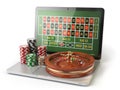 Online roulette casino concept. Laptop with roulette and casino