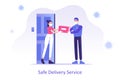 Online safe delivery service concept. Young courier man with medical mask delivering a package or box to woman during coronavirus Royalty Free Stock Photo