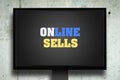 Online sales. The inscription on the monitor. Gray concrete background. Concept business