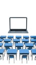 Online school in pandemic times. Laptop and classroom desks on white background. Royalty Free Stock Photo