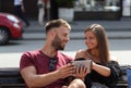 Online search. A young couple in love. The guy and the girl look each other straight in the eyes.