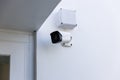 Online Security CCTV camera surveillance system outdoor of house. A blurred night city scape background. Real time Modern CCTV cam Royalty Free Stock Photo