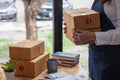 Online seller packs and opts for logistics service that can pick up from her office to save time and deliver fast delivery. Online