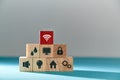 Online services. E-payment of utility services. Pyramid of wooden cubes with public utilities signs, red block on top