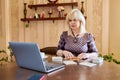 Online session with psychologist, woman using laptop and metaphorical associative cards Royalty Free Stock Photo