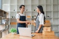 Online shopping Asia couple handshake to express joy and success. Online shopping concept Royalty Free Stock Photo