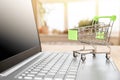 Online shopping concept. Shopping Cart on Laptop. laptop and grocery trolley. online shopping and delivery concept Royalty Free Stock Photo