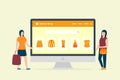 Online shopping concept with computer desktop and ecommerce shopping icon with two woman Royalty Free Stock Photo