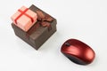 Online shopping concept with gift box and computer mouse isolated on white Royalty Free Stock Photo