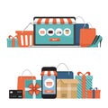 Online shopping concept. Online store objects and banner. Table with laptop, shopping bags, credit cards, gifts and coupons. Flat