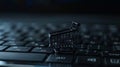 Online shopping concept, small shopping cart stands on keyboard, dark background, digital e-commerce. Generative AI Royalty Free Stock Photo