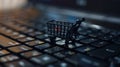 Online shopping concept, small shopping cart stands on keyboard, dark background, digital e-commerce. Generative AI Royalty Free Stock Photo