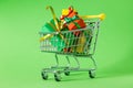 Online shopping concept - trolley cart full of presents