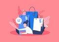 Online shopping concept. Woman lying with a bag of goods ordered from online shopping.