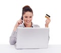 Online shopping, credit card and a woman with a laptop and phone call isolated on white background. Happy, female Royalty Free Stock Photo