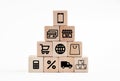 Online shopping or e-commerce concept with online business icons on wooden cubes against white background. Royalty Free Stock Photo