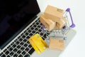 Online shopping or ecommmerce delivery service concept,Paper box on a laptop computer ,Easy shopping online concept Royalty Free Stock Photo