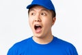 Online shopping, fast shipping, employees and home delivery concept. Close-up of surprised and amazed asian male courier