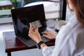 Online shopping, Hands woman holding credit card and using laptop in the coffee shop