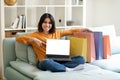 Online Shopping. Happy Arab Woman Pointing At Laptop With Blank Screen Royalty Free Stock Photo