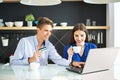 Online Shopping. Happy smiling couple using credit card to shop online at home. Royalty Free Stock Photo