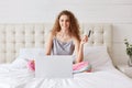 Online shopping at home. Adorable young woman holds plastic card Royalty Free Stock Photo