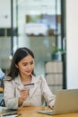Online Shopping and Internet Payments, Beautiful Asian women are using their credit cards and computer laptop to shop Royalty Free Stock Photo