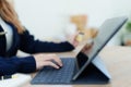 Online Shopping and Internet Payments, Beautiful Asian women are using their credit cards and tablet computer laptop to Royalty Free Stock Photo