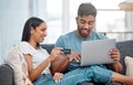 Online shopping, laptop and credit card, couple on sofa in living room and internet banking in home. Technology Royalty Free Stock Photo