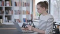 Online Shopping on Laptop by Young Woman, Library Royalty Free Stock Photo