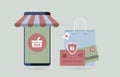 Online Shopping - Mobile E-Commerce concept. Smartphone with a shopping cart of an online store and a package with Royalty Free Stock Photo