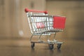 Concept of online shopping: Little shopping cart on delivery boxes Royalty Free Stock Photo