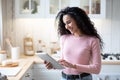 Online Shopping. Portrait Of Happy Young Woman Using Digital Tablet In Kitchen Royalty Free Stock Photo