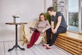 Online shopping using laptop, young couple is choosing furniture in new apartment. Royalty Free Stock Photo