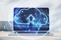 Online storage, cloud computing technology concept with front view on digital cloud symbol with arrow surrounded by virtual