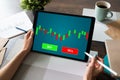 Online Trading Currency Forex Stock Market concept on screen with Economic graphs Candle chart and SELL and BUY buttons. Royalty Free Stock Photo