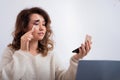 Online training for make-up. A woman teacher explains the makeup application scheme on the air Royalty Free Stock Photo