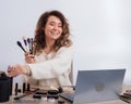 Online training for make-up. A woman teacher explains the makeup application scheme on the air Royalty Free Stock Photo