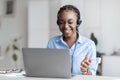 Online Tutoring. Black Female Tutor In Headset Having Video Conference With Laptop