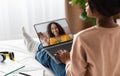 Online Tutoring Concept. Black Woman Using Laptop For Virtual Lesson With Tutor