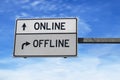 Online versus offline. White two street signs with arrow on metal pole. Directional road. Crossroads Road Sign, Two Arrow.