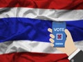 Online vote , poll, exit poll for Thailand general election concept. hand holding phone and confirm vote via mobile phone casting