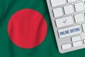 Online voting concept in People Republic of Bangladesh. Keyboard near country flag