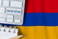 Online voting concept in Republic of Armenia. Keyboard near country flag Royalty Free Stock Photo