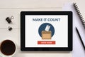 Online voting concept on tablet screen with office objects