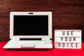 Online voting. Laptop and notepad on red background. Election concept, place for text