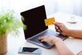 Black lady using laptop and credit card at home Royalty Free Stock Photo