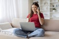 Online Work. Asian Female Working With Laptop And Cellphone At Home Royalty Free Stock Photo