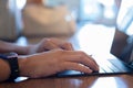 Online working on laptop computer, internet surfing, freelance work, close up. Businessman typing hands on laptop keyboard on desk Royalty Free Stock Photo