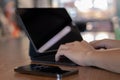 Online working on laptop computer, internet surfing, freelance work, close up. Businessman typing hands on laptop keyboard on desk